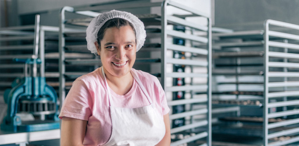 uLaunch - photo of a women smiling in a bakery