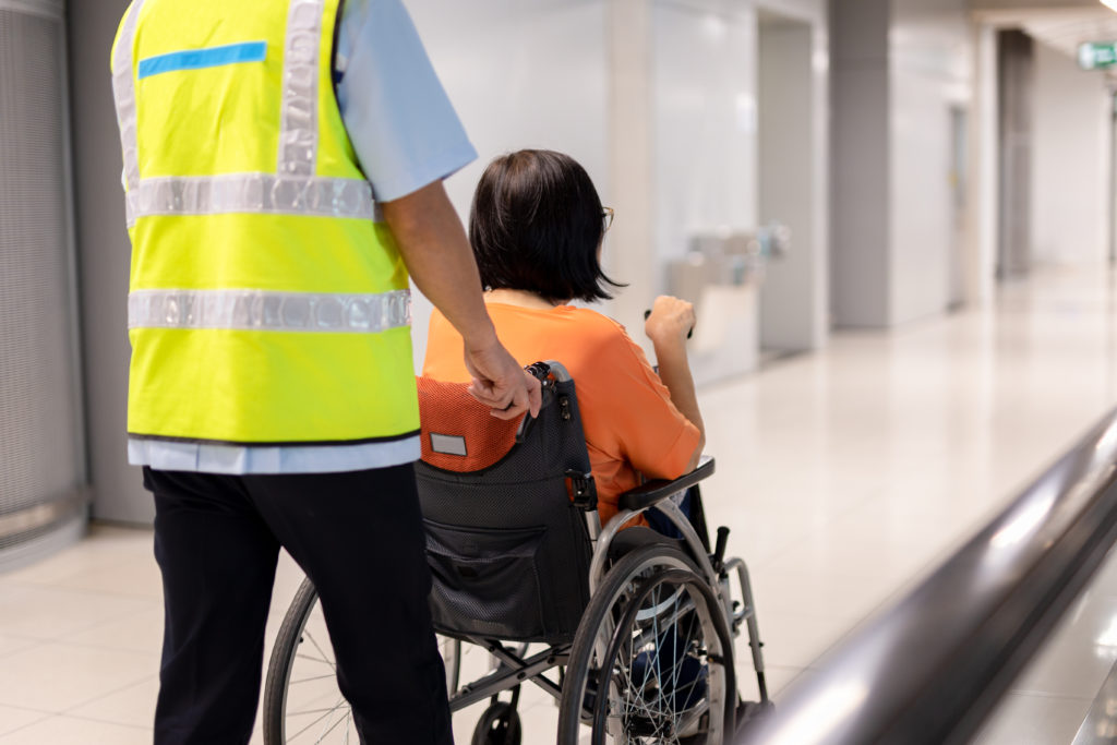 uLaunch - a new employment program from Sydney airport - photo of a person being pushed in a wheelchair