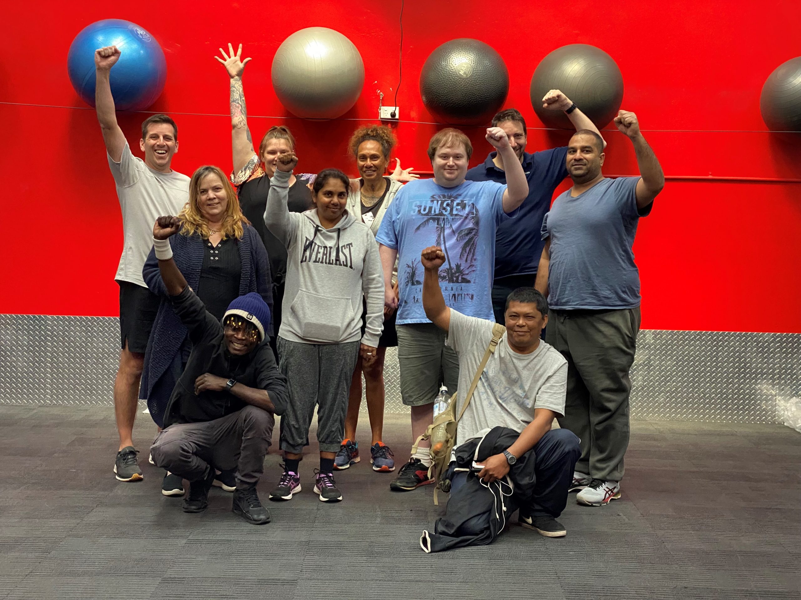 uLaunch - photo of group of happy people in a gym