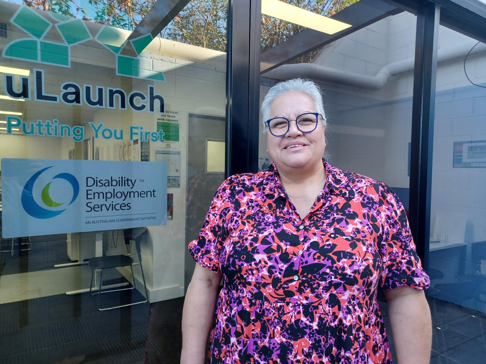 Roselyn smiling at the camera outside uLaunch Mount Gravatt office