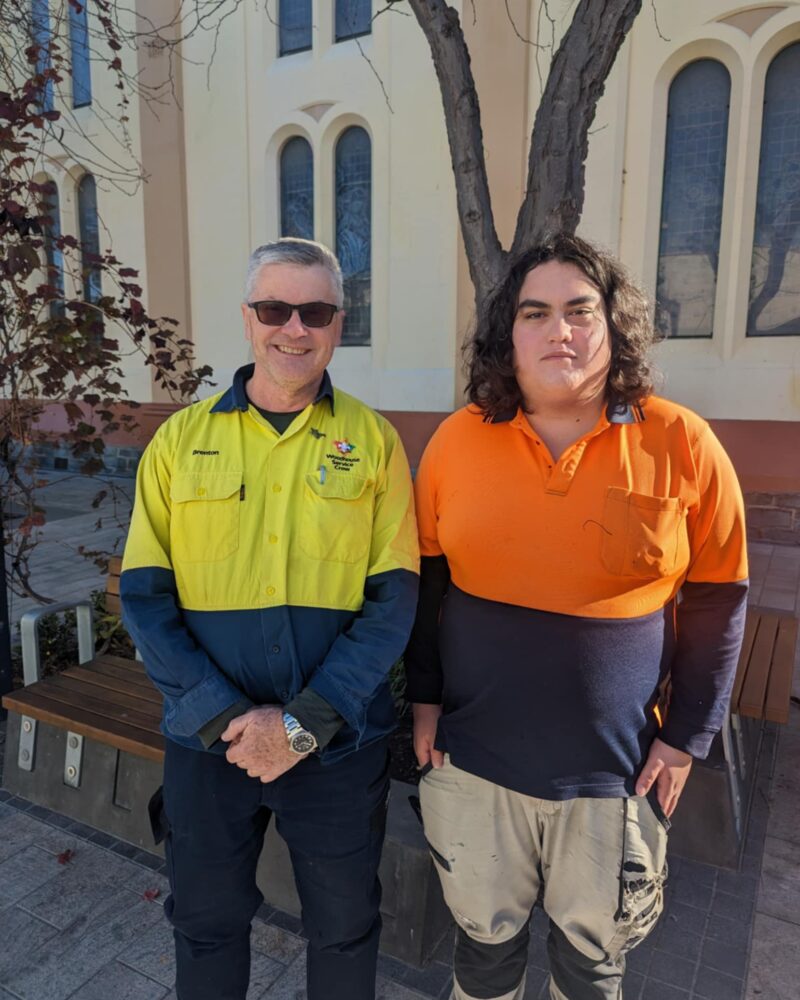 Luke and his co-worker at the garden centre