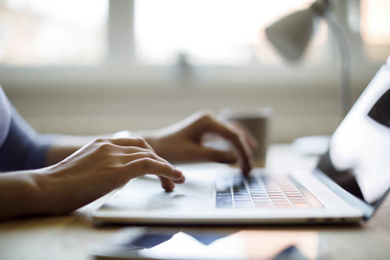 Woman using her laptop for online training.